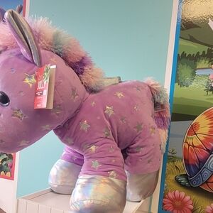 Purple Unicorn Plush with Star Pattern